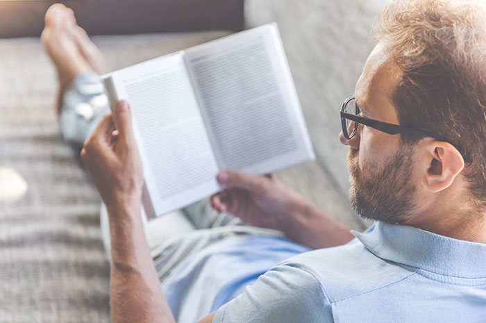 entrepreneur reading about recommended businesses