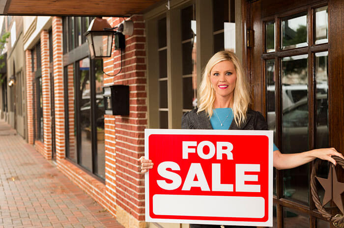businesswoman for sale sign